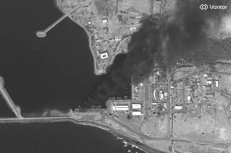 Satellite image showing Iranian warship burning at naval base